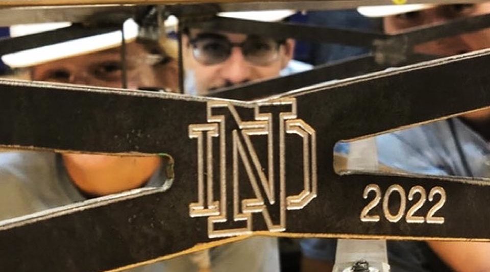 ND students looking through part of their bridge that has ND 2022 on it