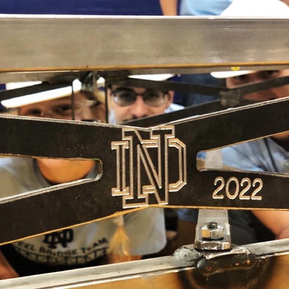 ND students looking through part of their bridge that has ND 2022 on it