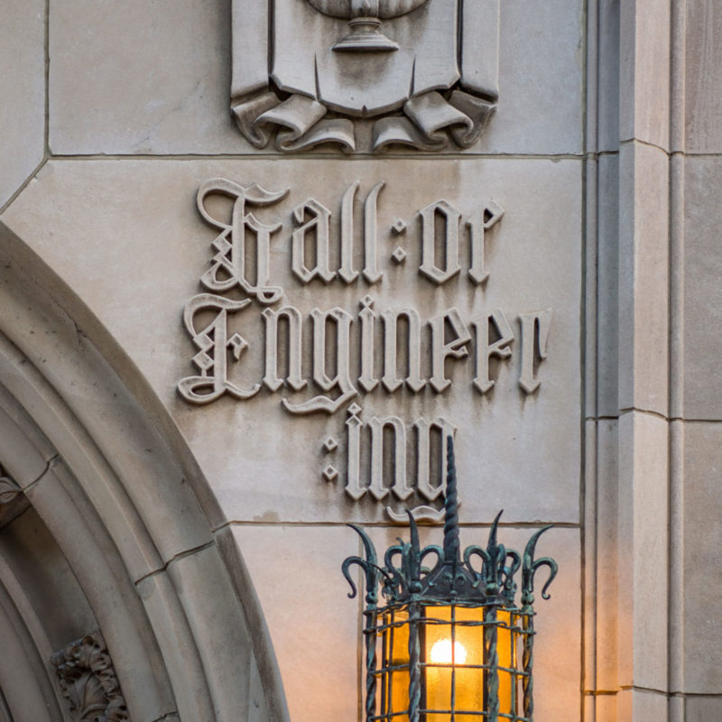 Relief of the words College of Engineering outside Cushing Hall Entrance