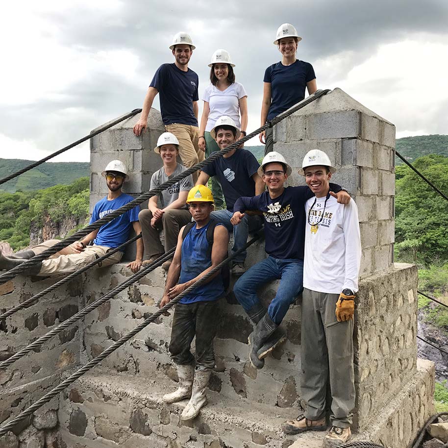 NDSeed members at the entrance of a bridge the team built